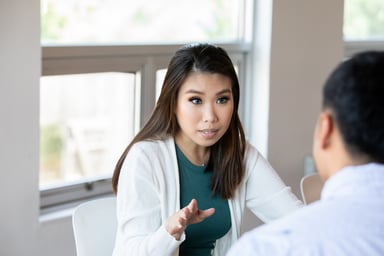 A person explaining something to another.