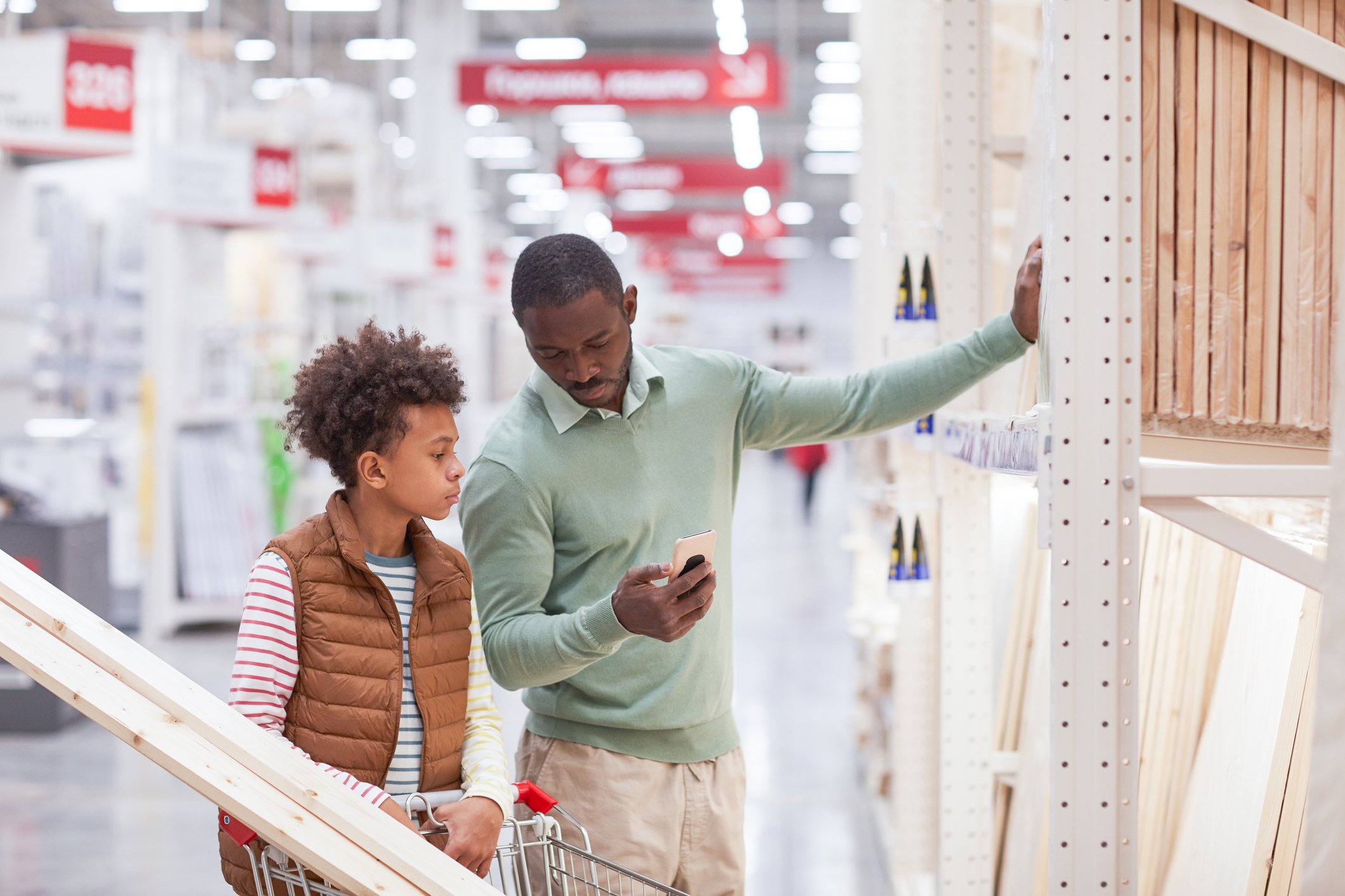 Two people shopping at a home improvement store.