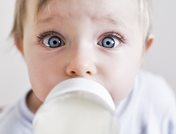Baby drinking a bottle of formula.