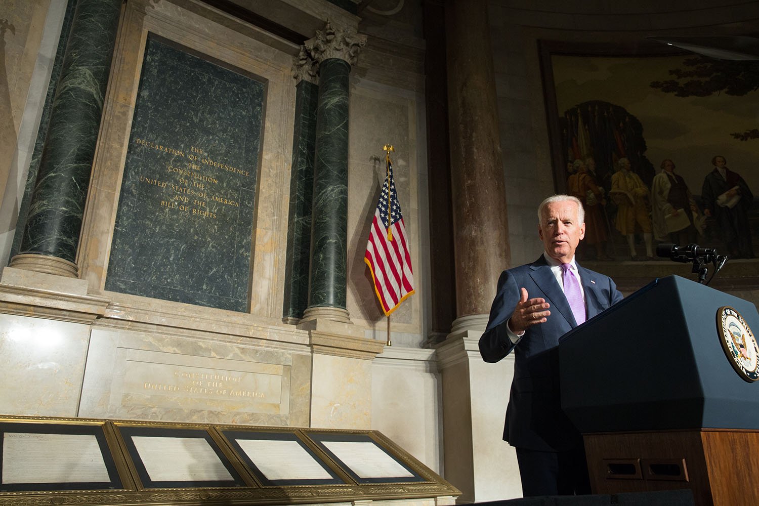 President Joe Biden standing at a podium.