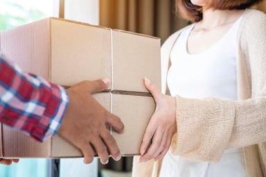 Delivery Man Sending Parcels to Lady