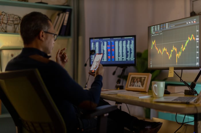 Investor looking at lots of stock information.