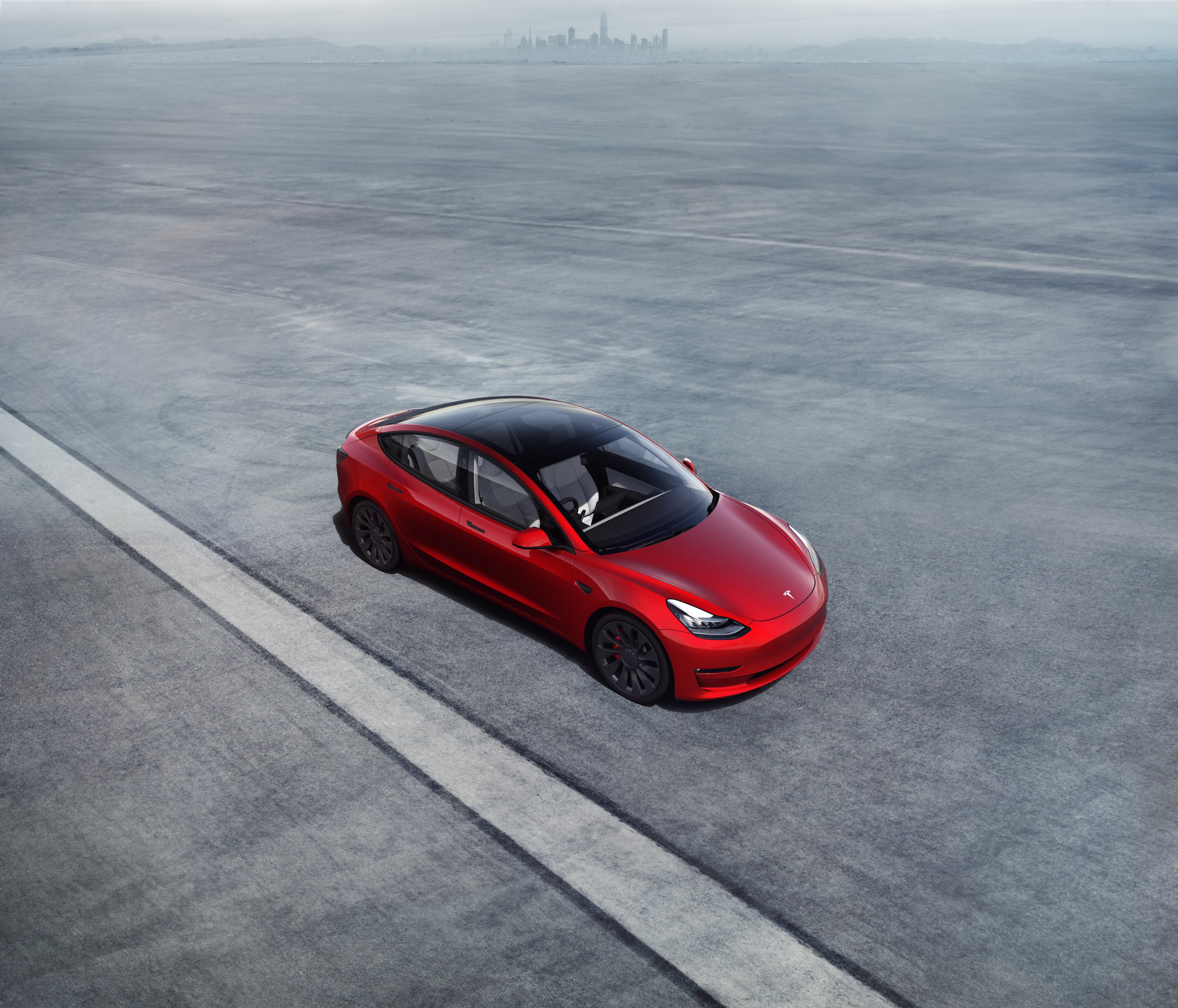 Red Tesla Model 3. 