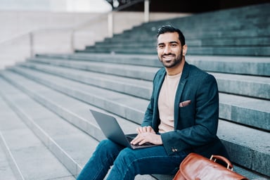 Investor checking stocks outside in city