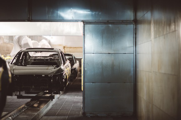 A car on an assembly line.