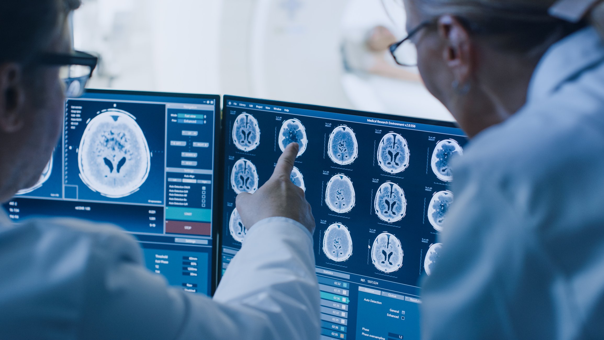 Scientists looking at brain scans