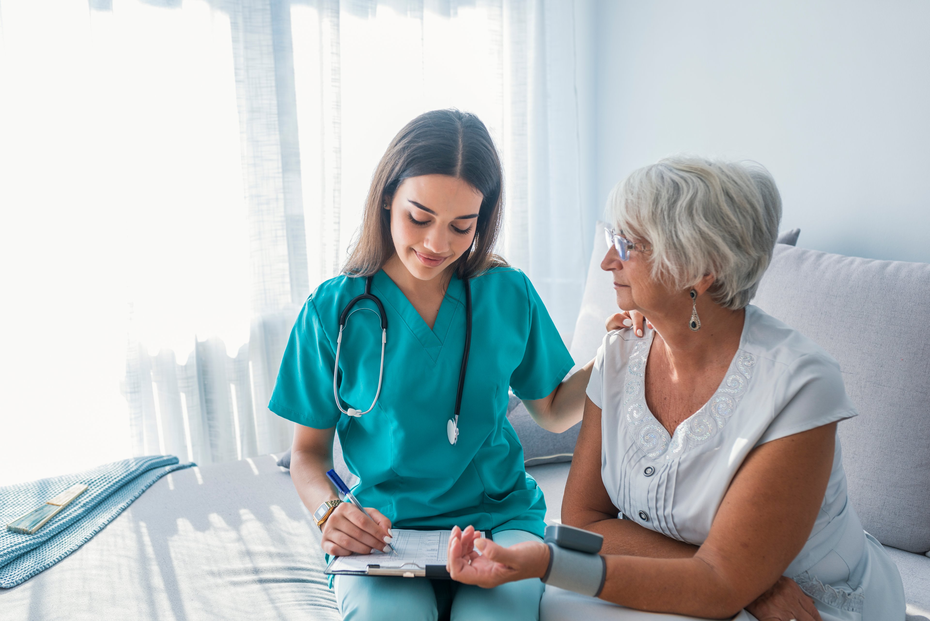 nurse with retired patient on table