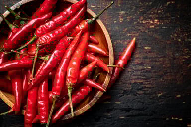 Chili peppers in wooden bowl