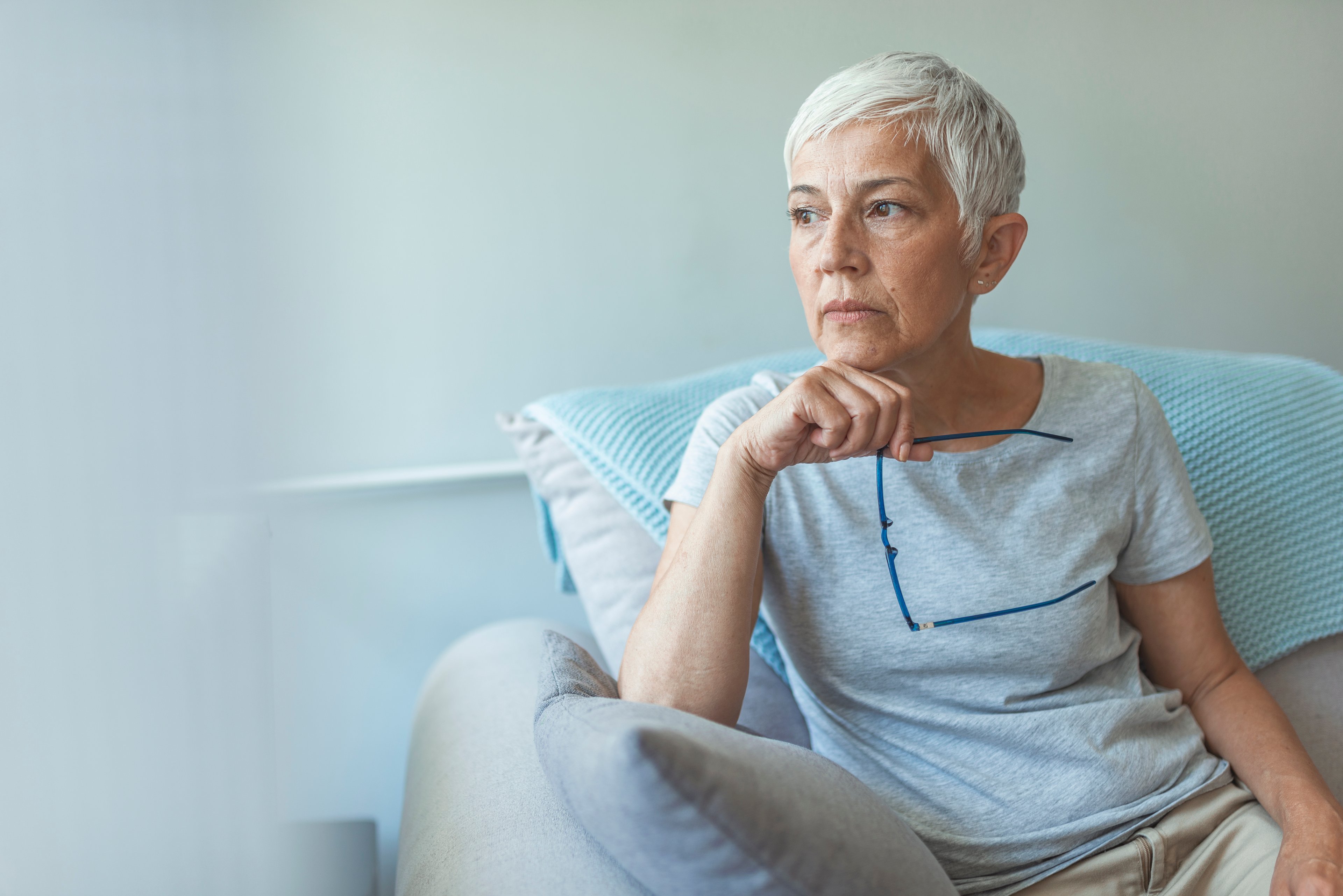 retired woman pensive thinking sad