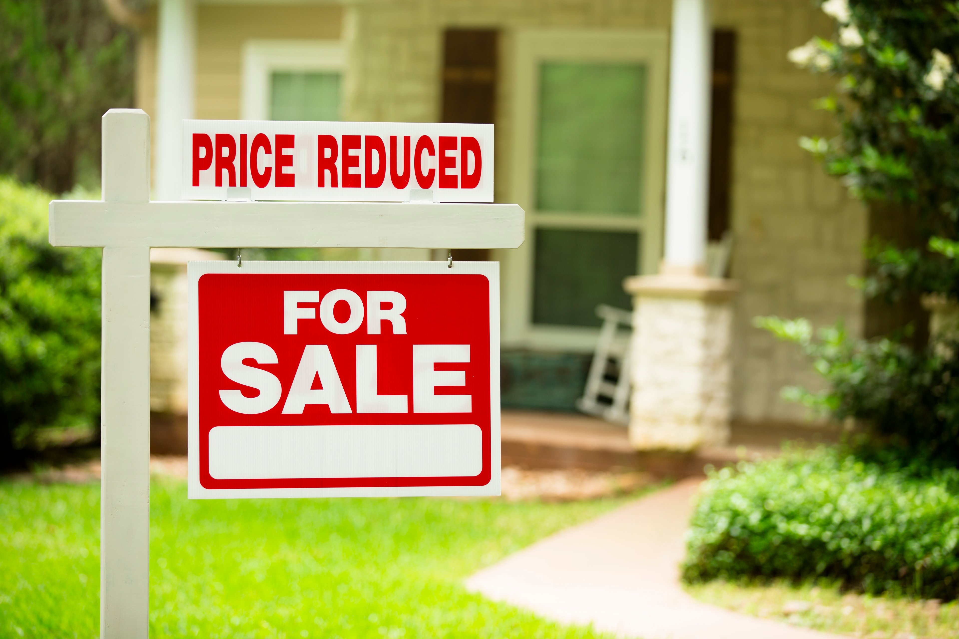 price reduction for sale home sign