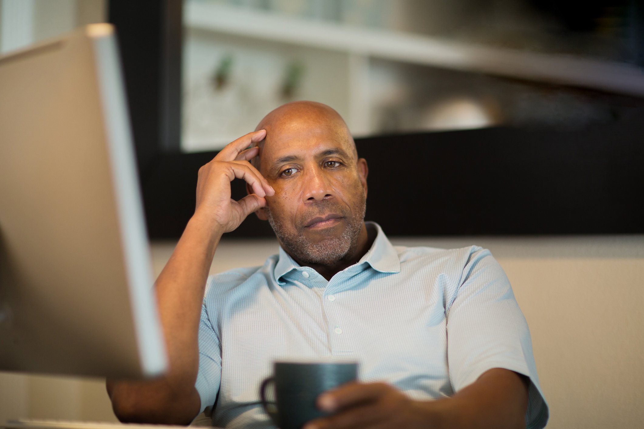 A person looking at a computer.
