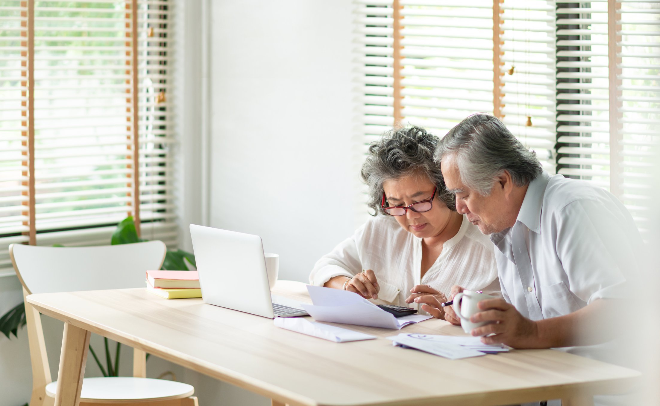 Two people looking at documents.