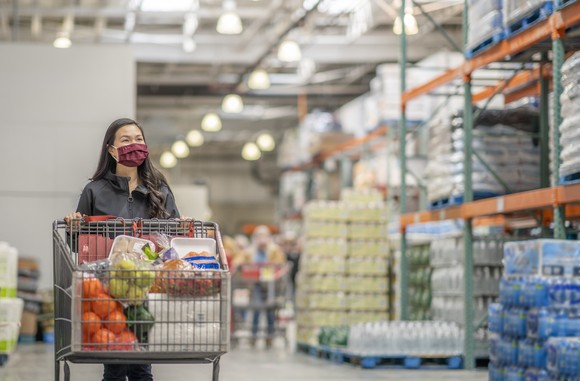 Customer shopping at a grocery warehouse.