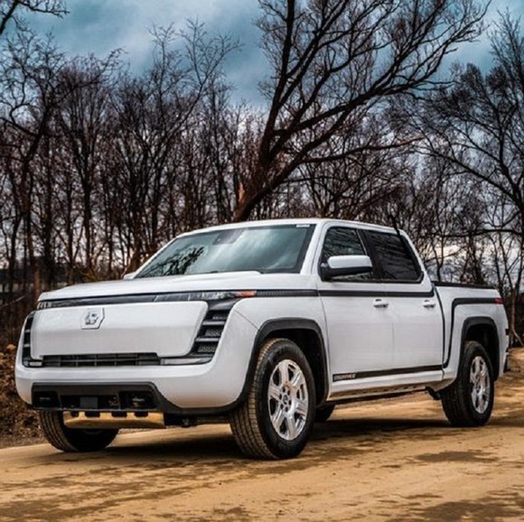 Endurance electric truck on a dirt road at dusk.