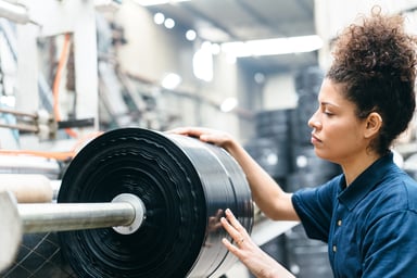 A person working in a plastic recyling factory