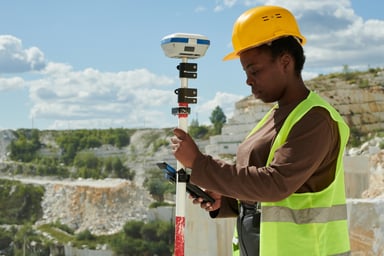 engineer adjusts technical equipment at a mine.