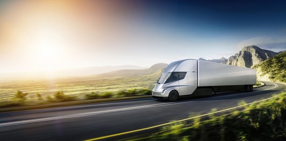 Tesla semi truck on scenic highway.