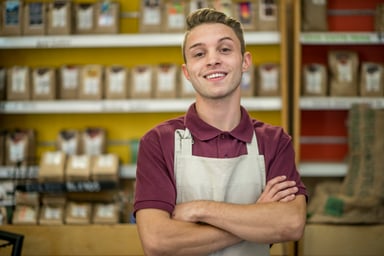 smiling employee in store apron