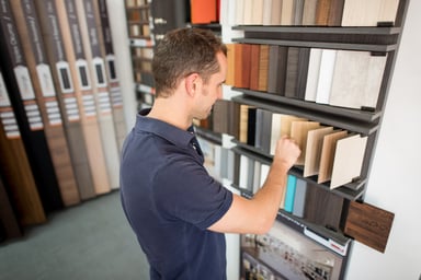 Shopper looks at tile samples