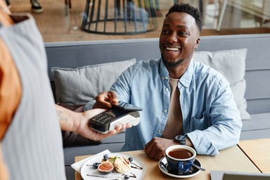 Person paying with mobile digital payment.