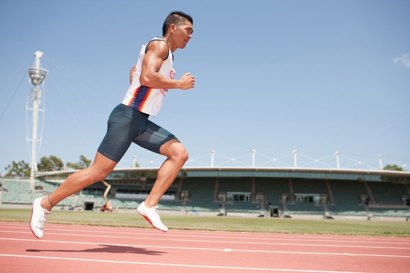 Runner on a stadium track.