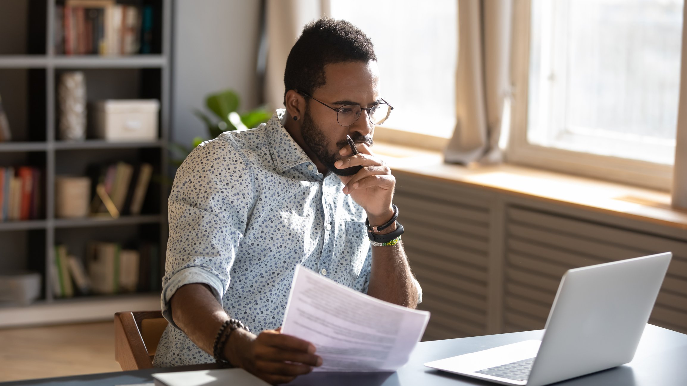 A person at desk looking at data.