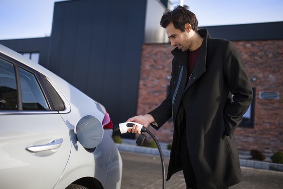 A person charging their electric car.