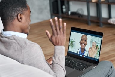 telemedicine_ man waves to doctor