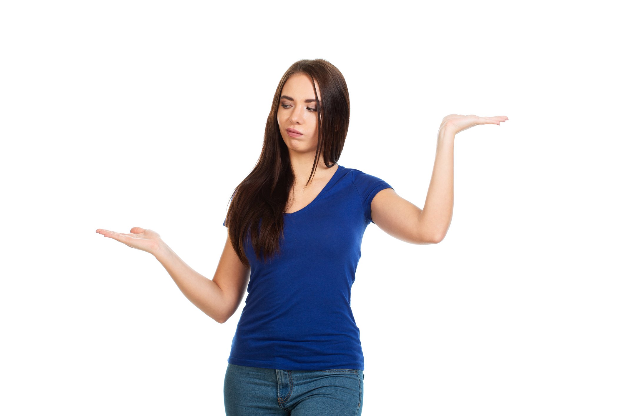 Person holding arms out on either side of their body, gesturing that they are chosing between two different options.