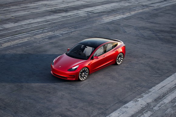 red Tesla Model 3. 