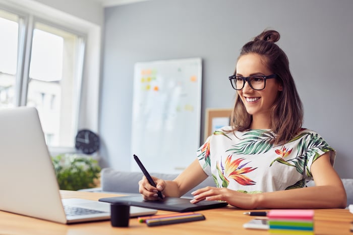 Graphic Designer Looking at Laptop.