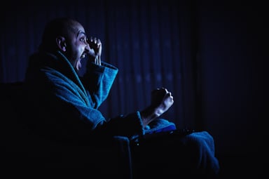 freaking out in the dark watching TV