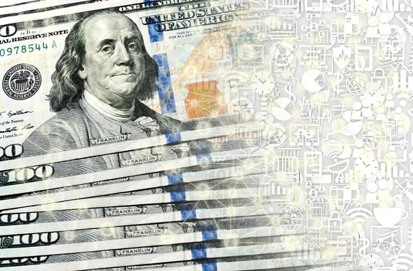 $100 bills transforming into digital currency.