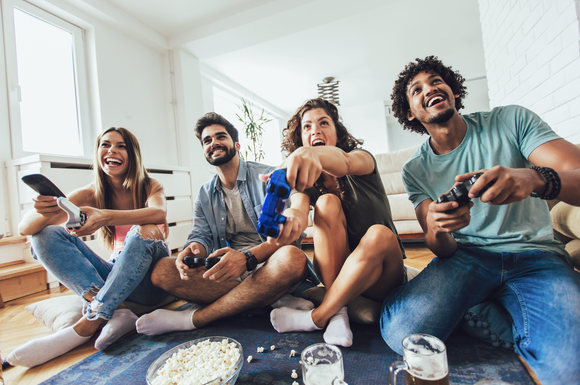 A group of friends playing video games.