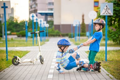 boys playing roller blades scooter