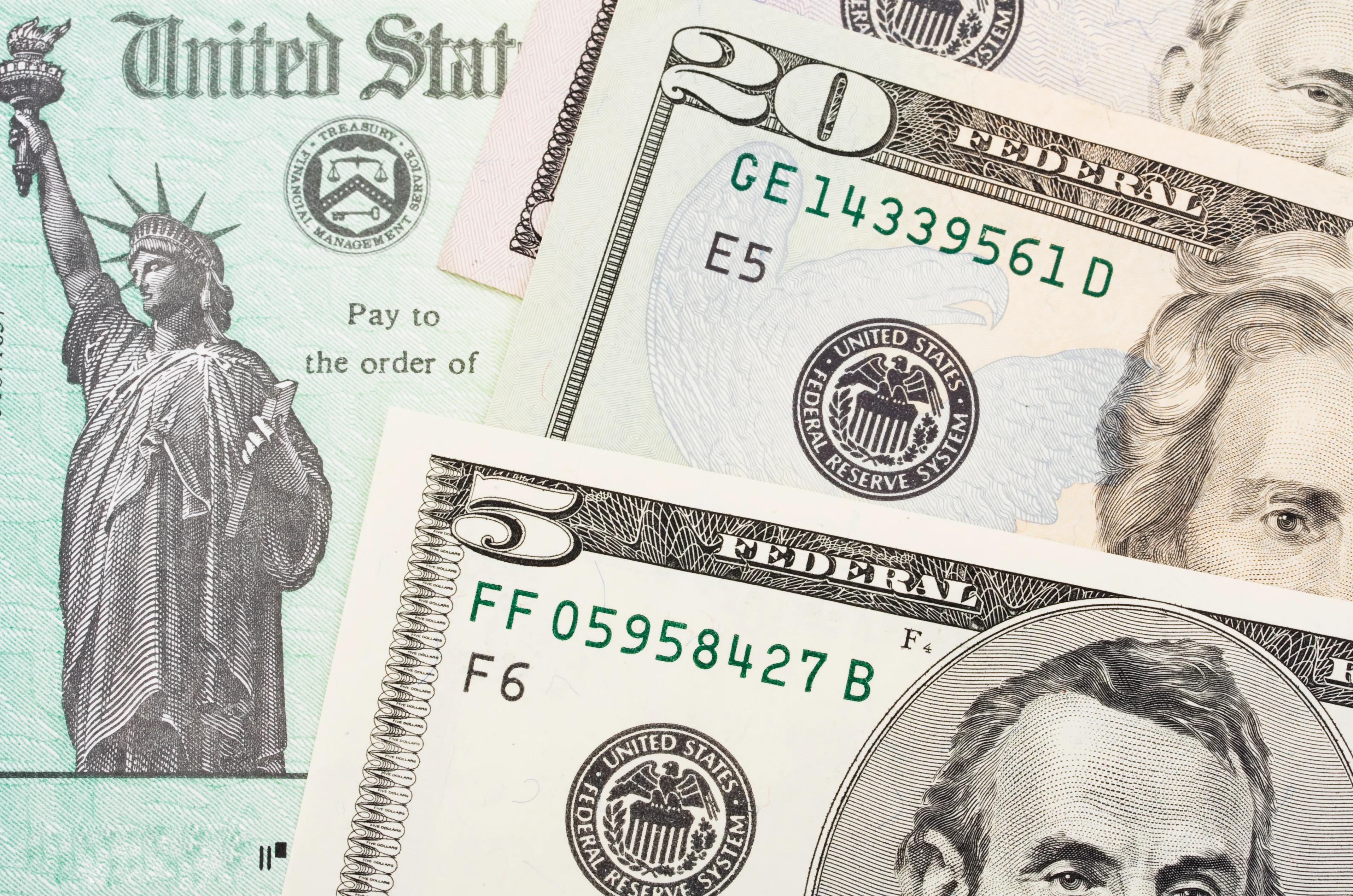 Check from U.S. Treasury alongside cash.