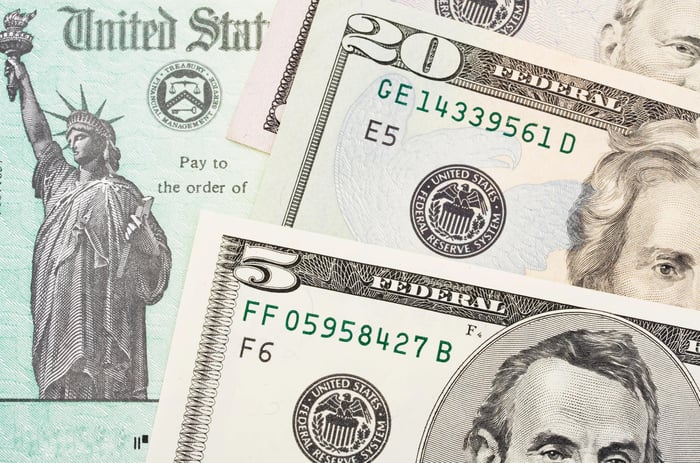 Check from U.S. Treasury alongside cash.