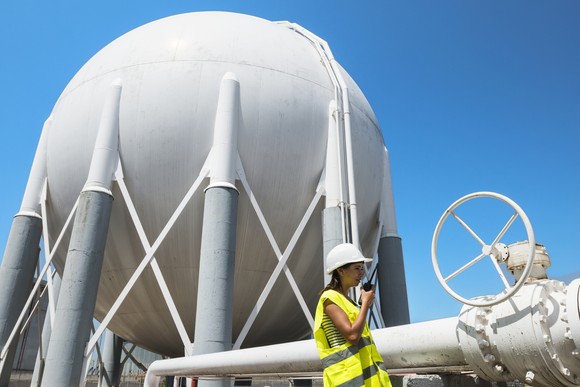 Worker near a storage tank.