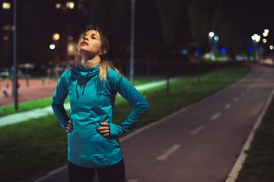 Tired person standing in the street