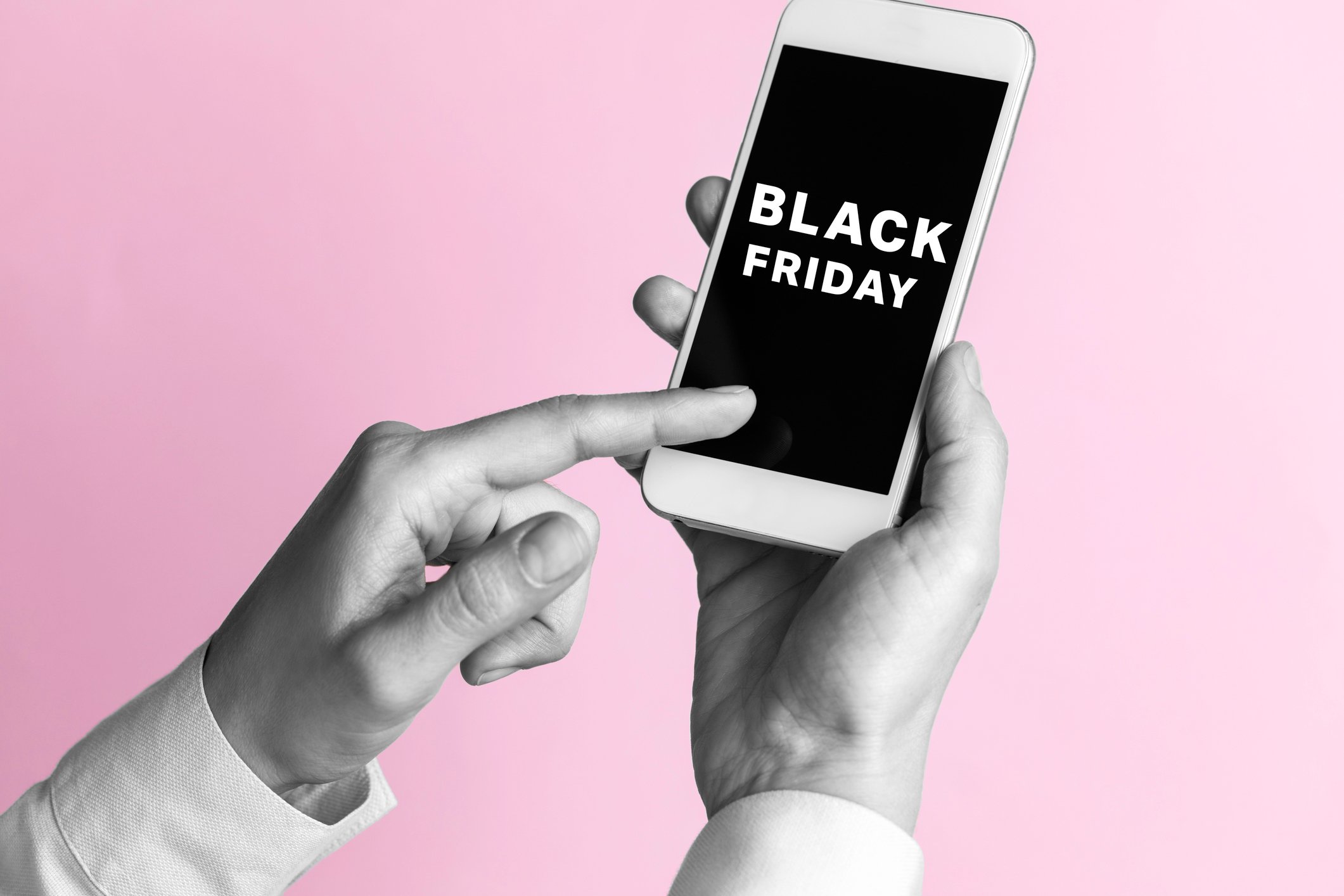 smartphone in user hands with "Black Friday" on the screen. 
