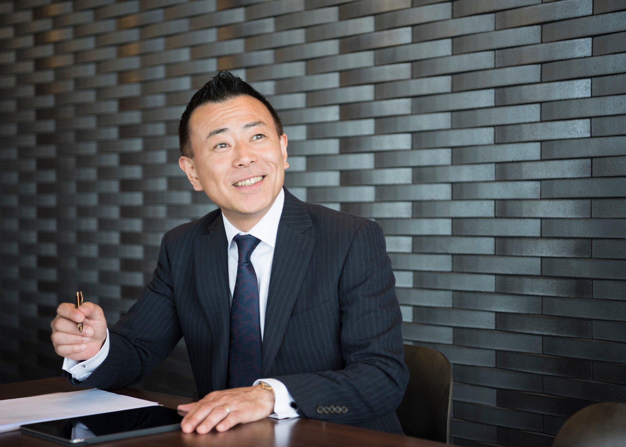 confident happy businessman taking notes