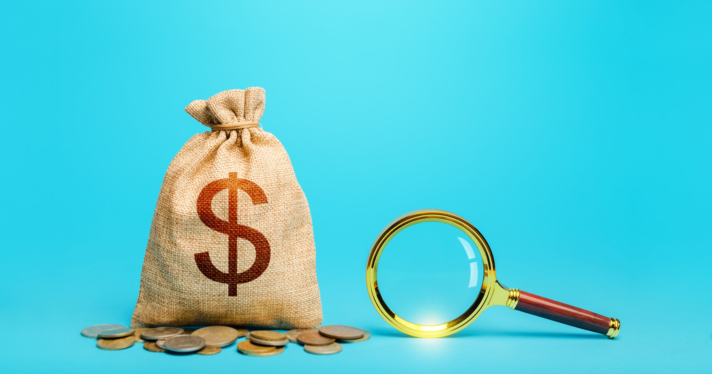 A bag of coins and a magnifying glass.