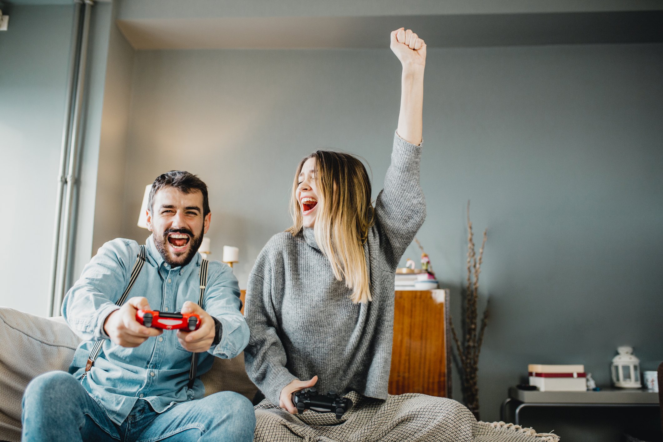 two people having fun playing a video game
