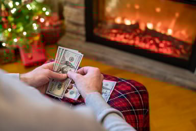 holiday counting money fireplace christmas tree
