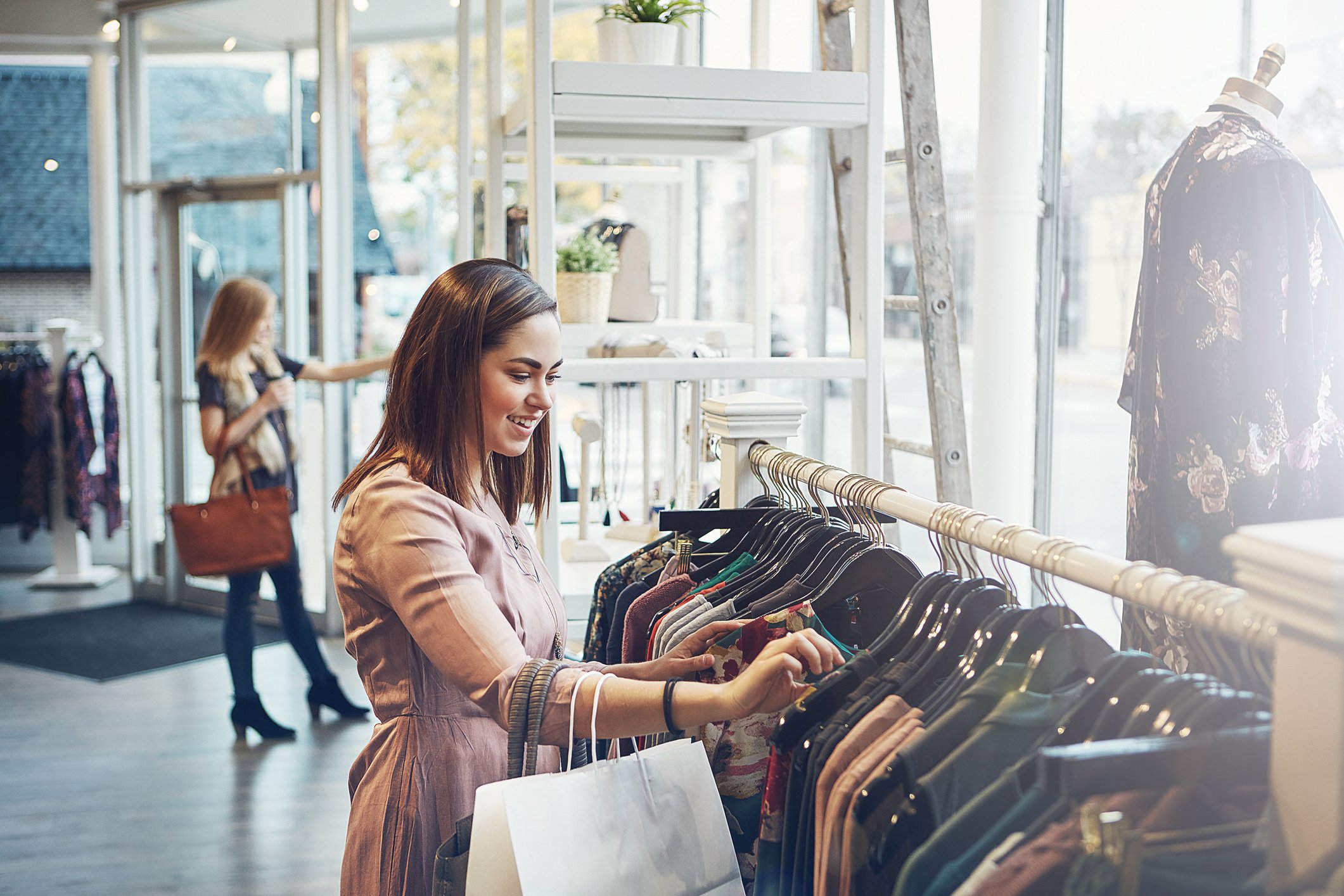 Customers shop at an apparel store.