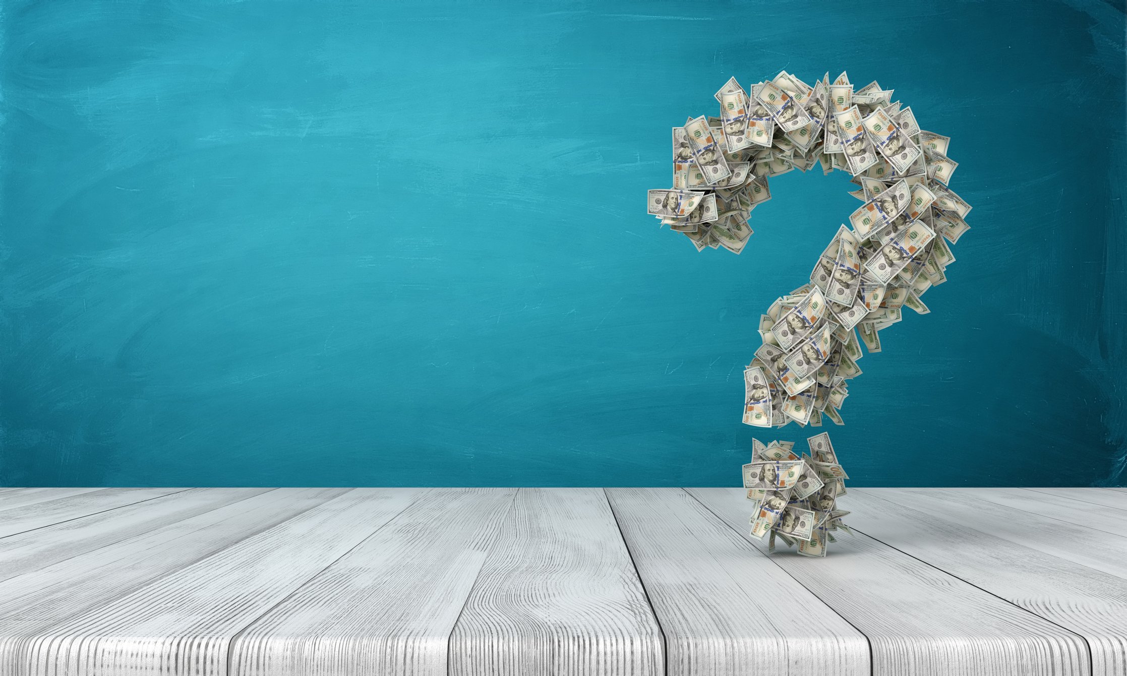 A question mark made of hundred-dollar bills.