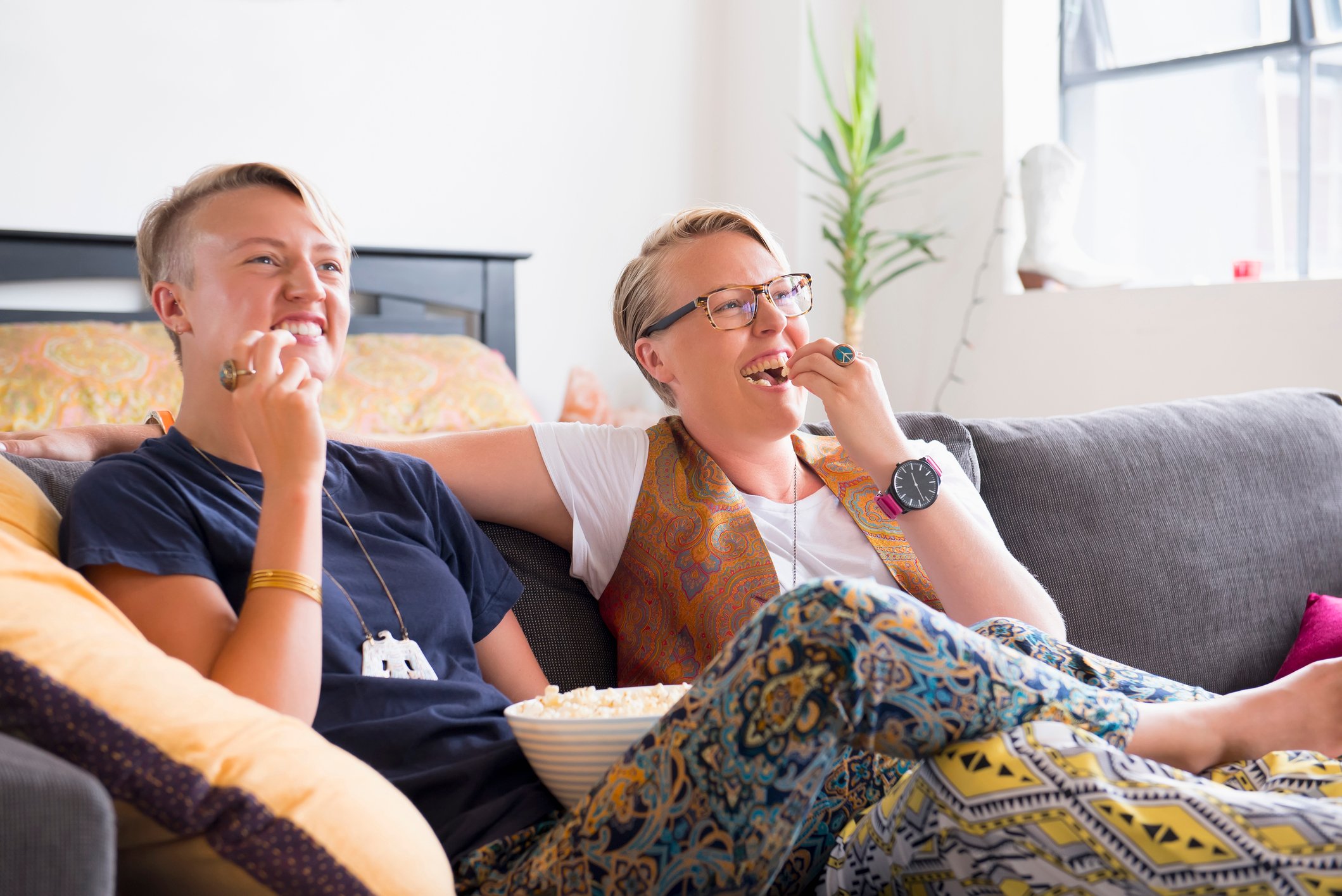 happy couple watching TV streaming video