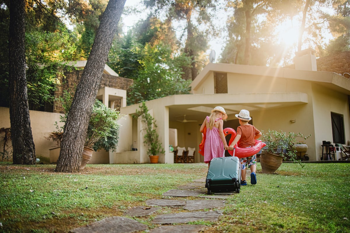 Two kids entering an Airbnb.
