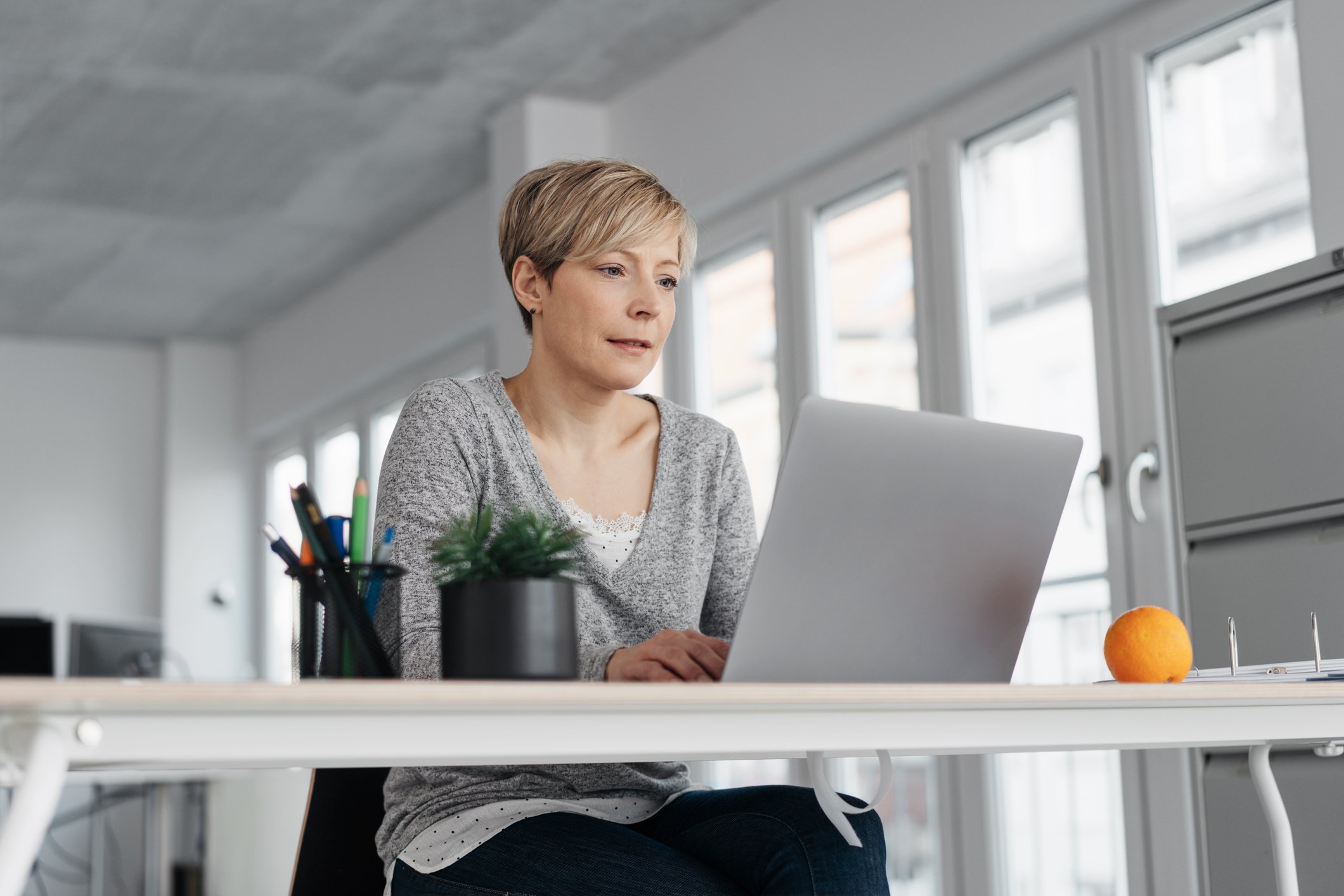 A person at a laptop.