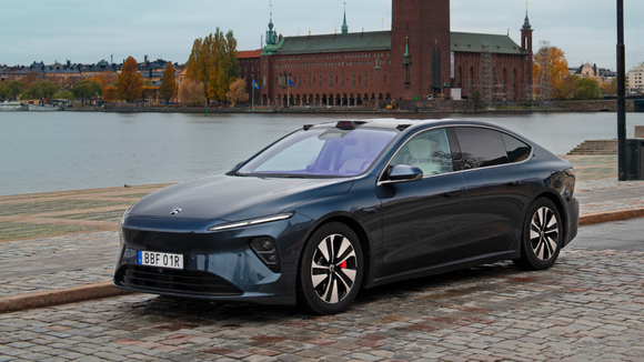A dark blue Nio electric sedan in Europe. 